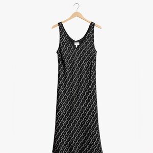A Wild Thyme Size 16 sleeveless lined black dress with geometric pattern
